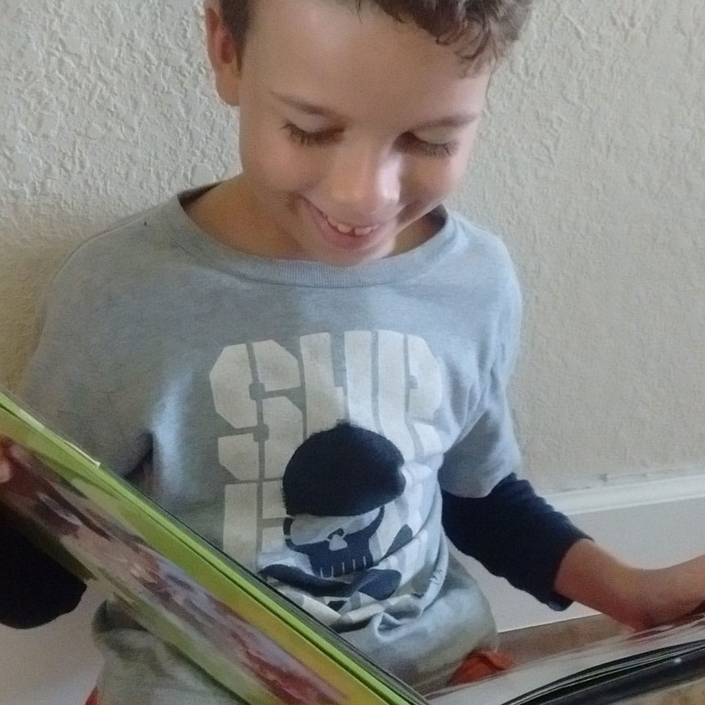 Young student reading a book