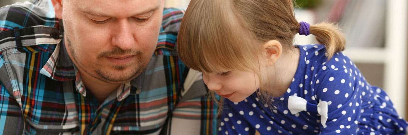 Young girl updating Dad on what she learned